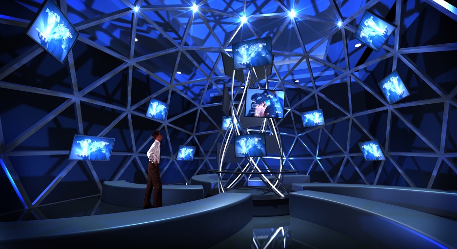 A person stands in a futuristic room with geometric metal structures and multiple screens displaying maps and digital graphics. The room is illuminated with blue lights, creating a sleek and modern atmosphere.