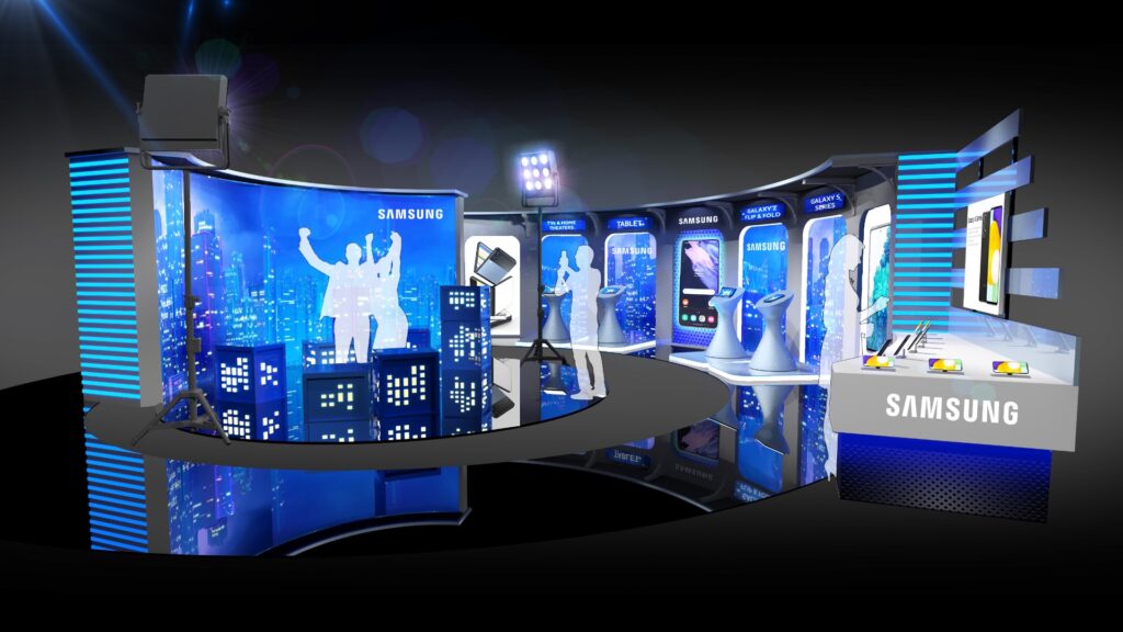 Futuristic Samsung exhibition booth with illuminated displays, digital screens, and interactive panels. The design features a modern cityscape backdrop and various tech products.