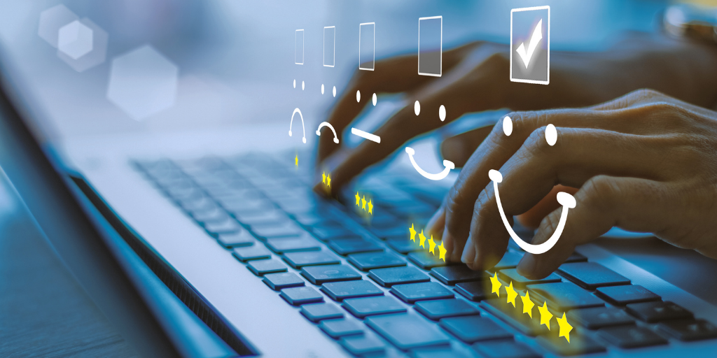 Hands typing on a laptop keyboard with digital smiley faces, checkboxes, and star ratings overlaid, symbolizing online feedback or customer retention.